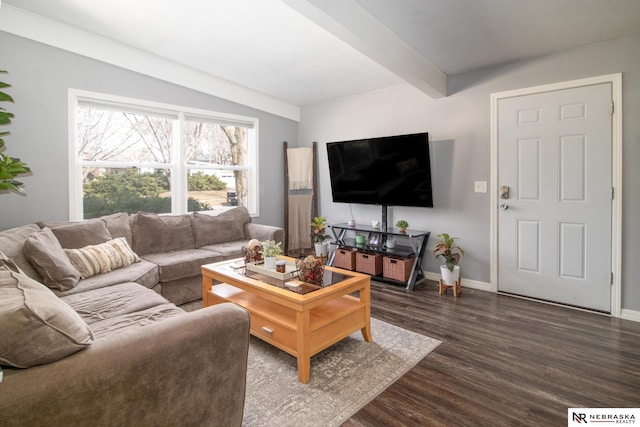 living room featuring baseboards, dark wood-style flooring, and beam ceiling