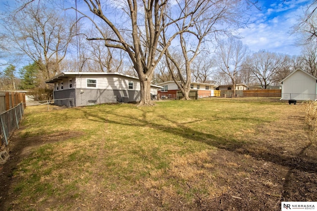 view of yard with a fenced backyard