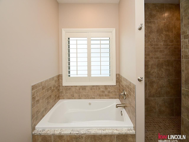 full bathroom with a garden tub
