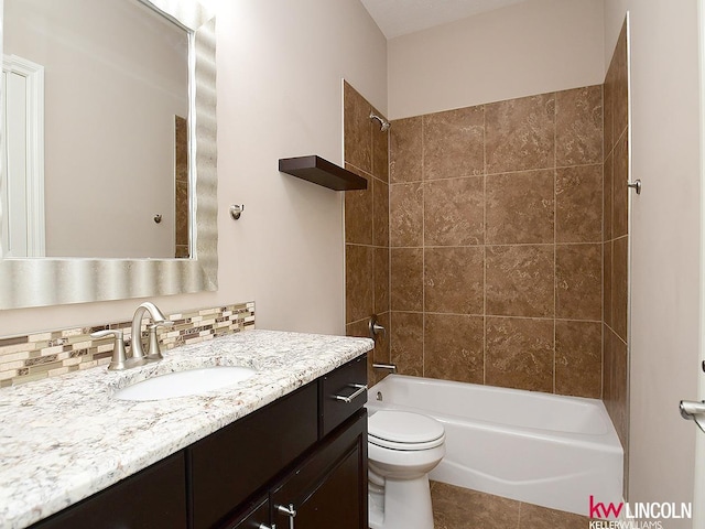 bathroom featuring vanity, tile patterned flooring, tub / shower combination, and toilet