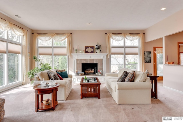 living room with carpet, a fireplace, and recessed lighting