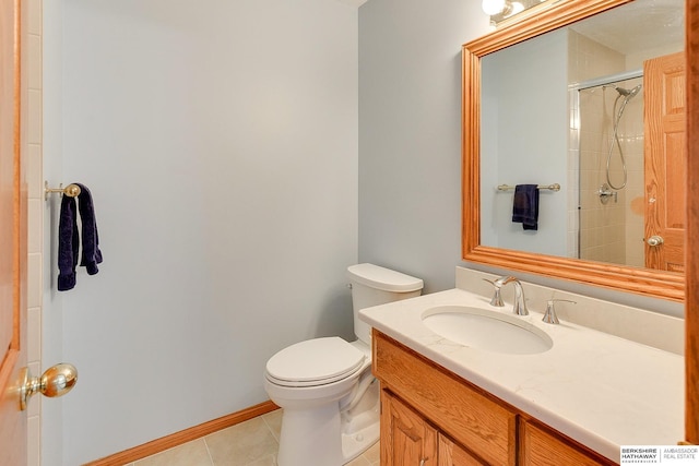 bathroom featuring tile patterned flooring, toilet, vanity, and tiled shower