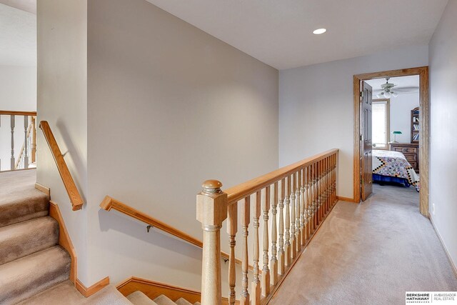 stairs with carpet flooring, ceiling fan, recessed lighting, and baseboards