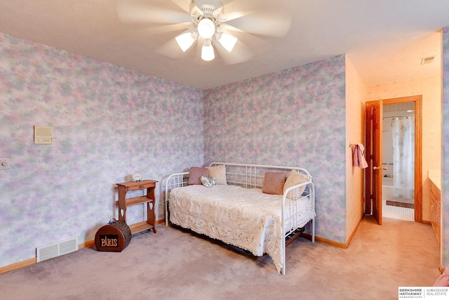 bedroom with carpet floors, baseboards, wallpapered walls, and ceiling fan