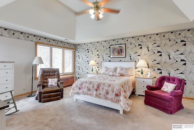 bedroom featuring carpet floors, baseboards, wallpapered walls, high vaulted ceiling, and a ceiling fan