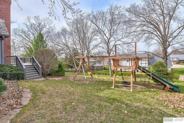 view of yard featuring stairs and a playground