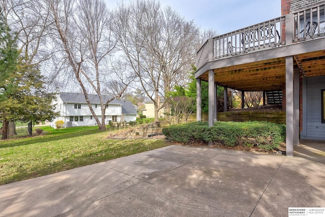 view of patio / terrace with a wooden deck and a residential view