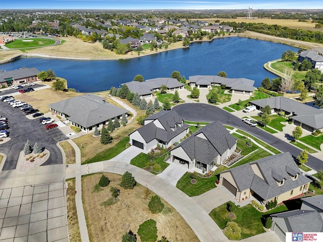 bird's eye view featuring a residential view and a water view