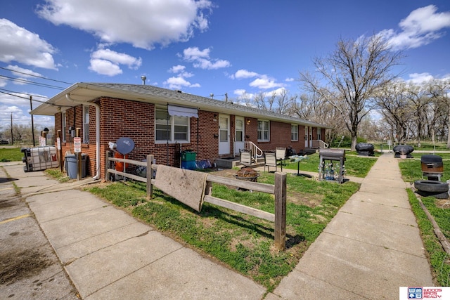 4821-31-41 Colfax Ave, Lincoln, NE 68504 - view of front of home featuring fence and brick siding