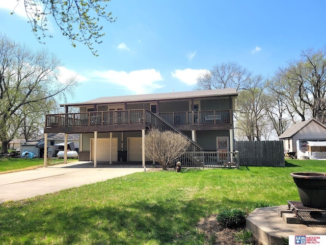 1321 Frances St, Goehner, NE 68364 - view of front of house featuring stairway, fence, a front lawn, a wooden deck, and a garage