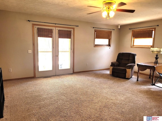 1321 Frances St, Goehner, NE 68364 - sitting room featuring a ceiling fan, a healthy amount of sunlight, french doors, and carpet