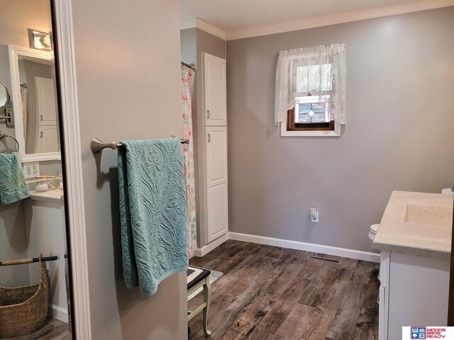 1321 Frances St, Goehner, NE 68364 - full bathroom with wood finished floors, vanity, baseboards, ornamental molding, and visible vents
