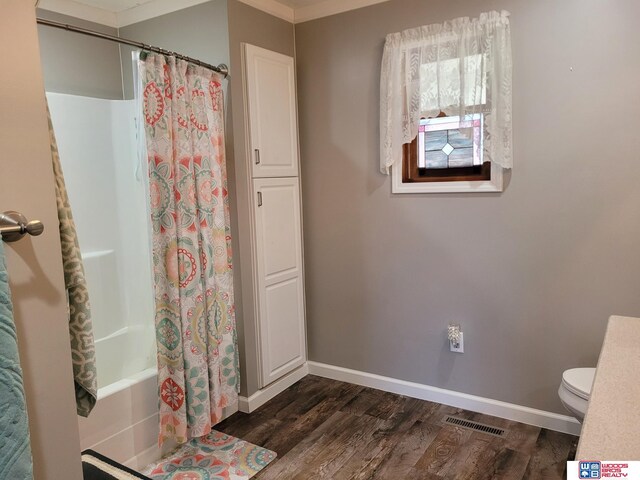 1321 Frances St, Goehner, NE 68364 - bathroom featuring wood finished floors, baseboards, toilet, ornamental molding, and visible vents