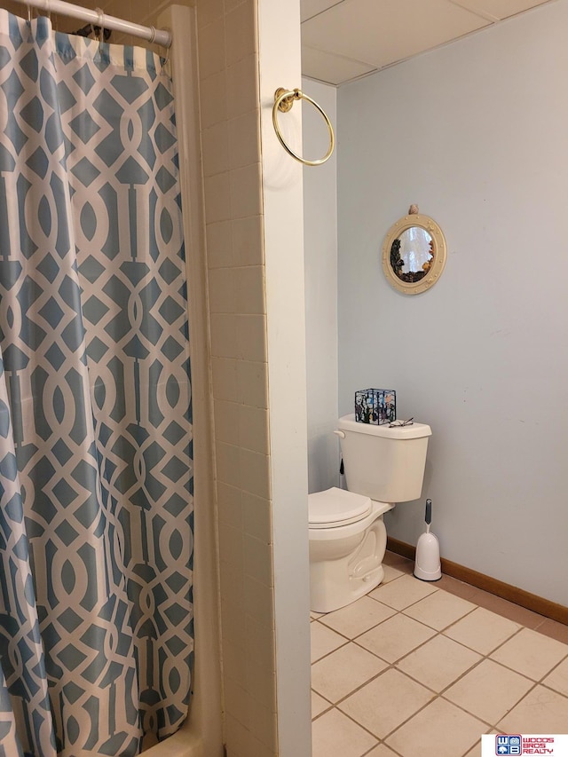 1321 Frances St, Goehner, NE 68364 - bathroom featuring a shower with curtain, tile patterned floors, baseboards, and toilet