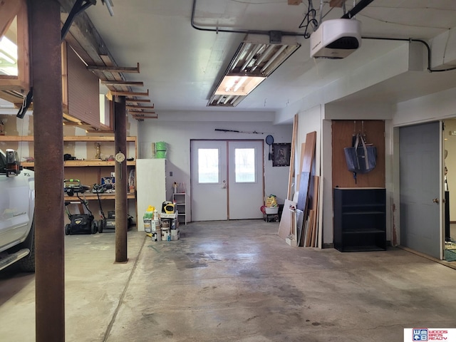1321 Frances St, Goehner, NE 68364 - garage featuring a garage door opener and french doors
