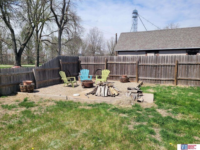 1321 Frances St, Goehner, NE 68364 - view of yard featuring a fire pit and a fenced backyard