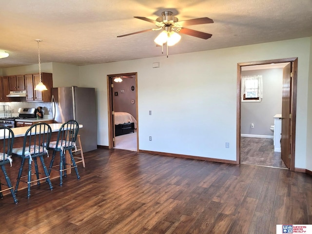 1321 Frances St, Goehner, NE 68364 - dining area featuring dark wood-type flooring, baseboards, and ceiling fan