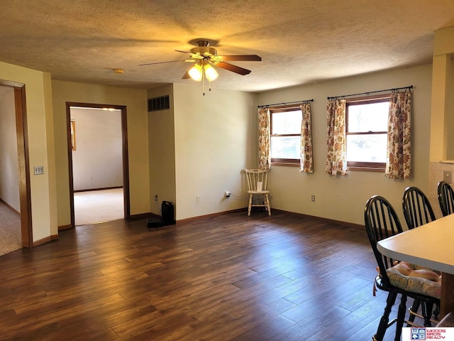 1321 Frances St, Goehner, NE 68364 - dining area with a textured ceiling, baseboards, visible vents, wood finished floors, and ceiling fan