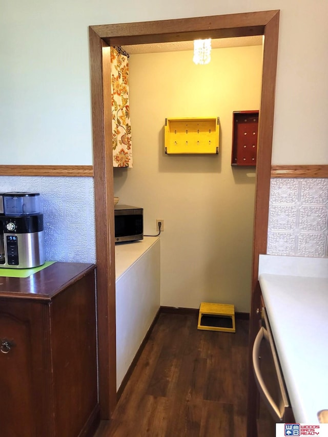 1321 Frances St, Goehner, NE 68364 - clothes washing area with dark wood-style floors