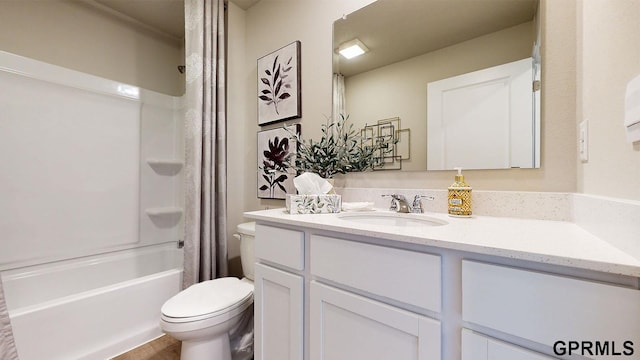 bathroom featuring toilet, shower / tub combo with curtain, and vanity