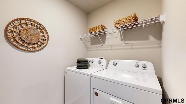 washroom featuring washer and dryer and laundry area