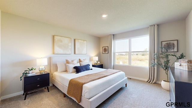 bedroom featuring a textured ceiling, light colored carpet, baseboards, and recessed lighting
