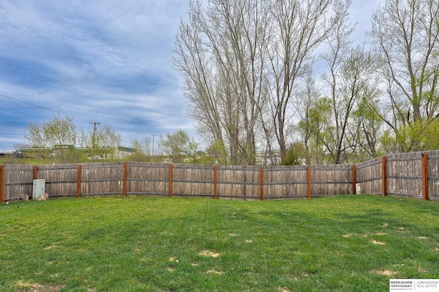 view of yard with a fenced backyard