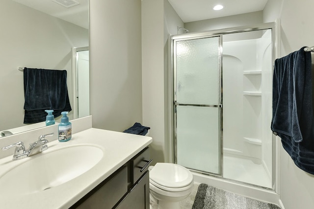 bathroom with vanity and a shower stall