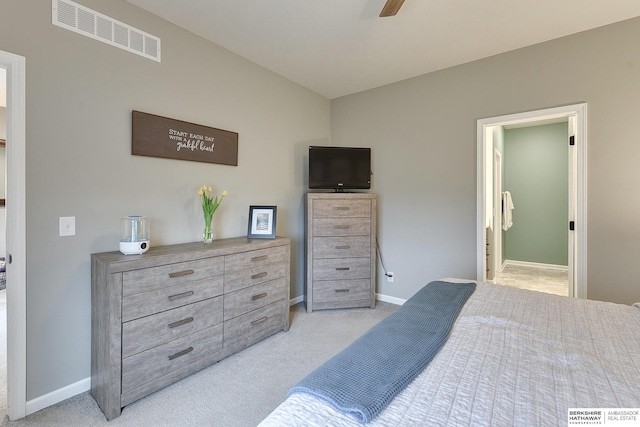 bedroom with ensuite bath, ceiling fan, light colored carpet, baseboards, and visible vents
