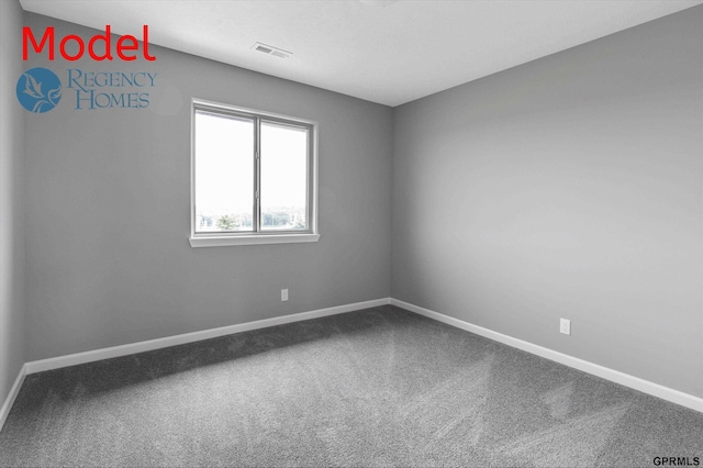 unfurnished room with baseboards, visible vents, and carpet floors