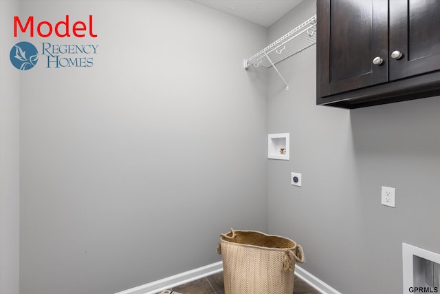 washroom with hookup for a washing machine, electric dryer hookup, cabinet space, baseboards, and dark wood-type flooring