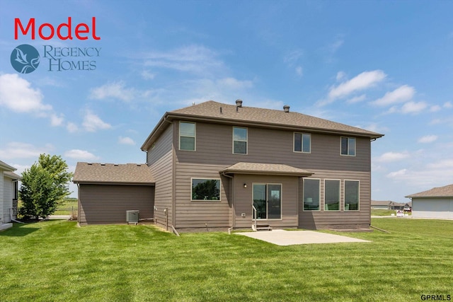 back of house featuring a lawn, central AC, a patio, and a shingled roof