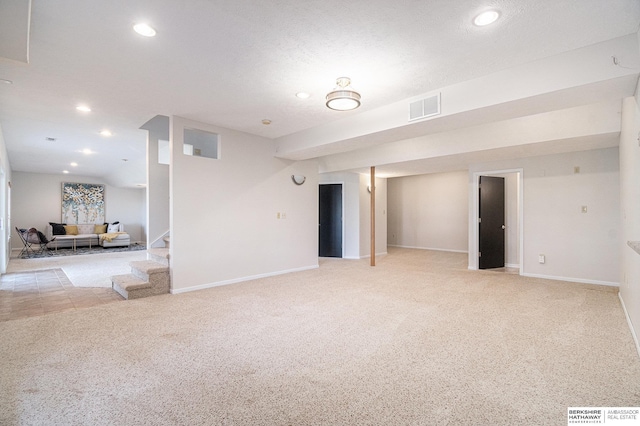 interior space featuring light carpet, visible vents, recessed lighting, and stairs