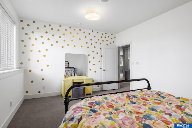 bedroom featuring wallpapered walls, baseboards, and carpet