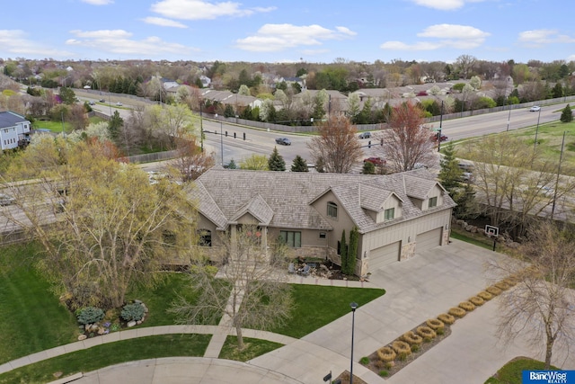 birds eye view of property with a residential view