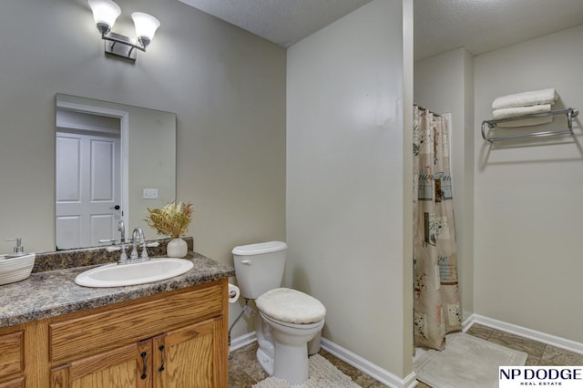 bathroom featuring a textured ceiling, vanity, curtained shower, baseboards, and toilet