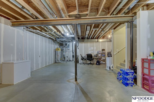 unfinished basement with refrigerator, water heater, and stairs