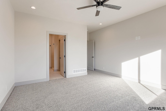 unfurnished bedroom with baseboards, visible vents, recessed lighting, and light colored carpet