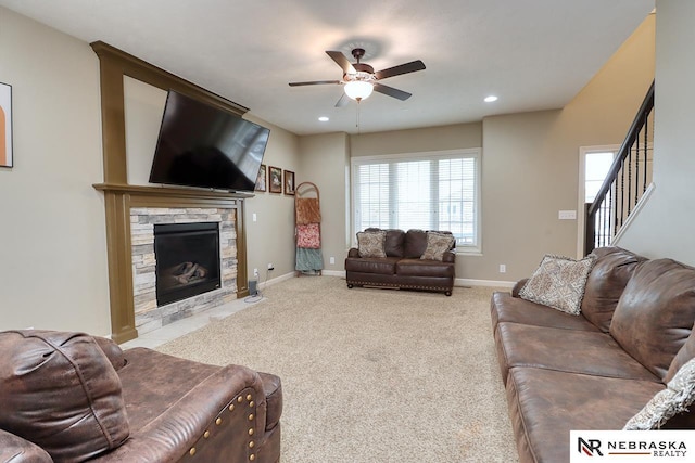 9441 Southern Sky Cir, Lincoln, NE 68505 - carpeted living area featuring stairway, a ceiling fan, a fireplace, baseboards, and recessed lighting