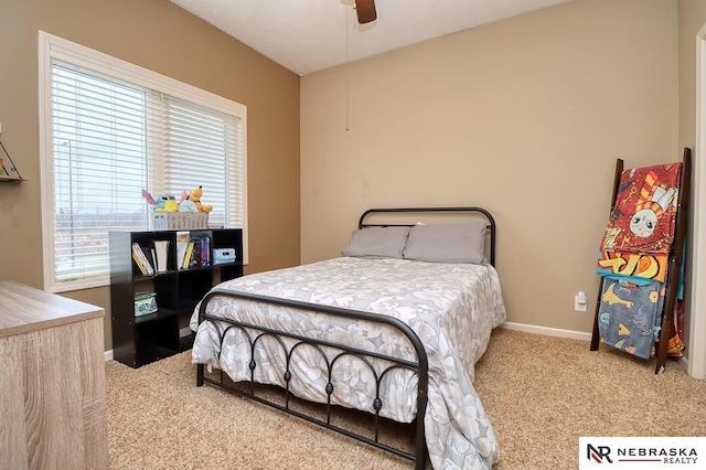 9441 Southern Sky Cir, Lincoln, NE 68505 - bedroom with baseboards, a ceiling fan, and carpet flooring