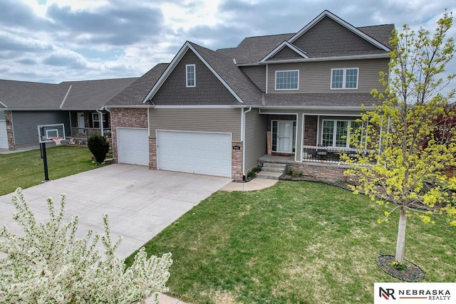 9441 Southern Sky Cir, Lincoln, NE 68505 - craftsman inspired home featuring an attached garage, driveway, a front lawn, and covered porch