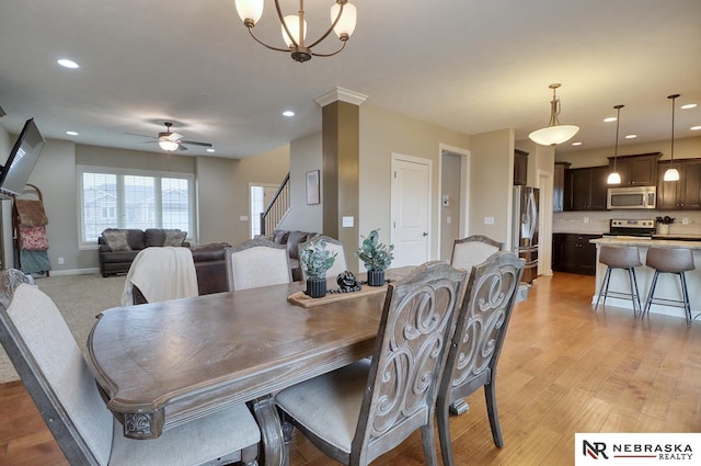 9441 Southern Sky Cir, Lincoln, NE 68505 - dining area featuring light wood-type flooring, baseboards, recessed lighting, a ceiling fan, and stairway