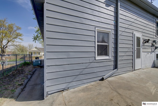 2725 Monroe St, Omaha, NE 68107 - view of home's exterior featuring a patio and fence