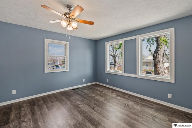 2725 Monroe St, Omaha, NE 68107 - unfurnished room featuring ceiling fan, baseboards, and wood finished floors