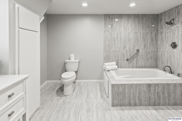 full bath with tiled shower / bath combo, recessed lighting, toilet, and vanity