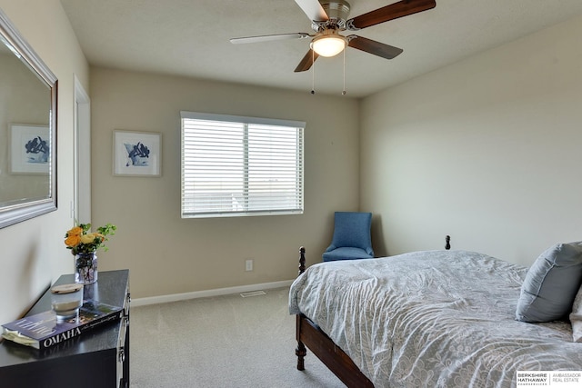 carpeted bedroom with visible vents, baseboards, and ceiling fan
