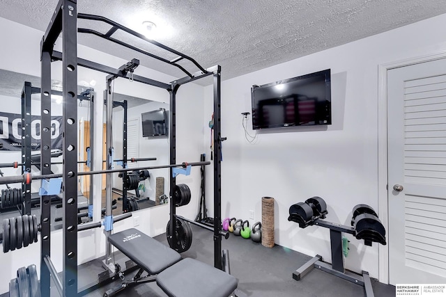 workout area with a textured ceiling