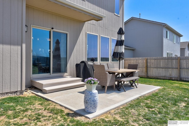 view of patio featuring fence