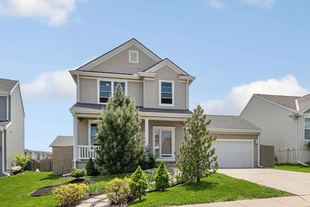 view of front facade with driveway, an attached garage, and a porch