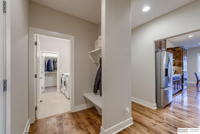 mudroom with washing machine and clothes dryer, baseboards, recessed lighting, and light wood-type flooring
